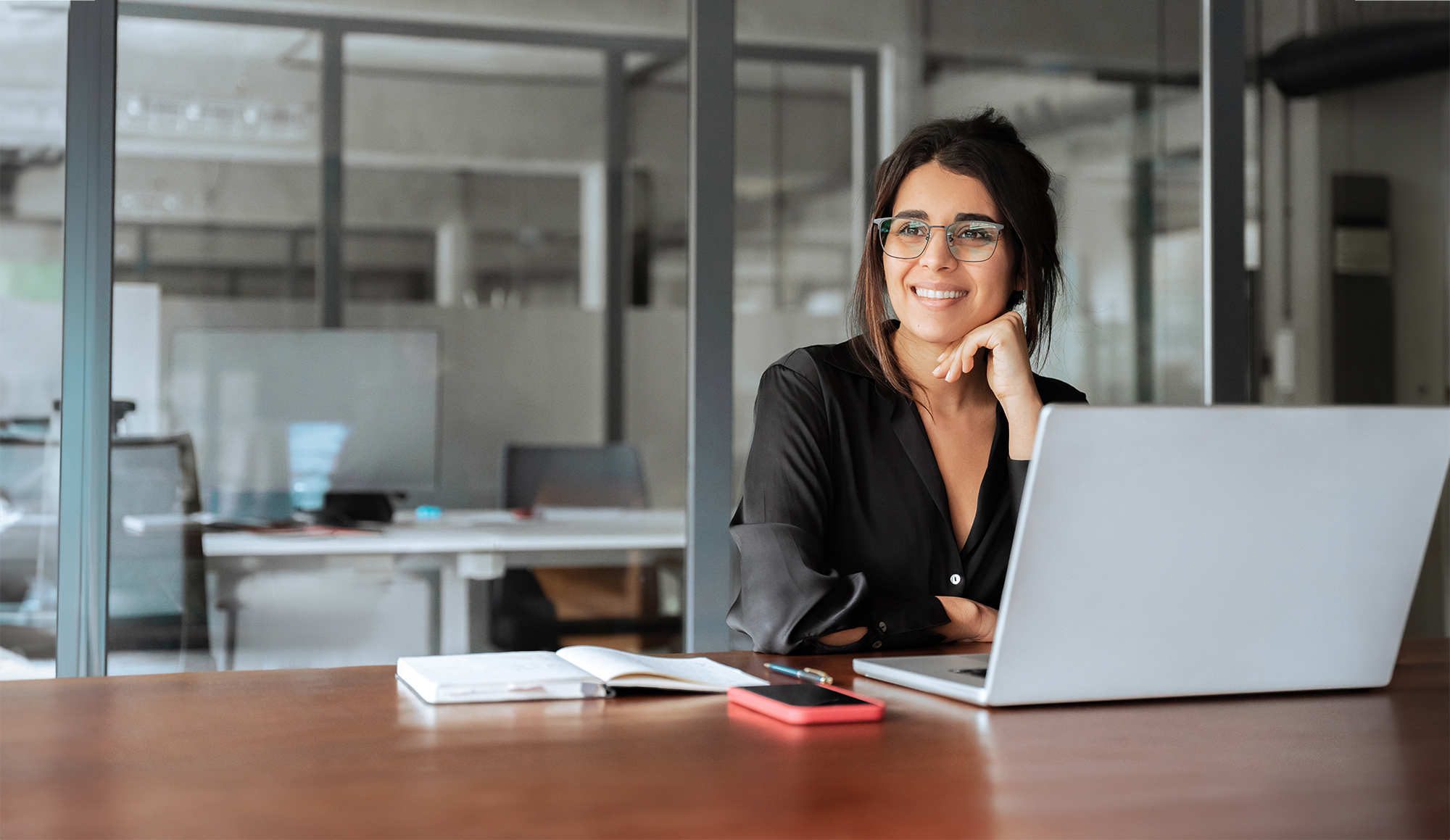 person at desk with laptop