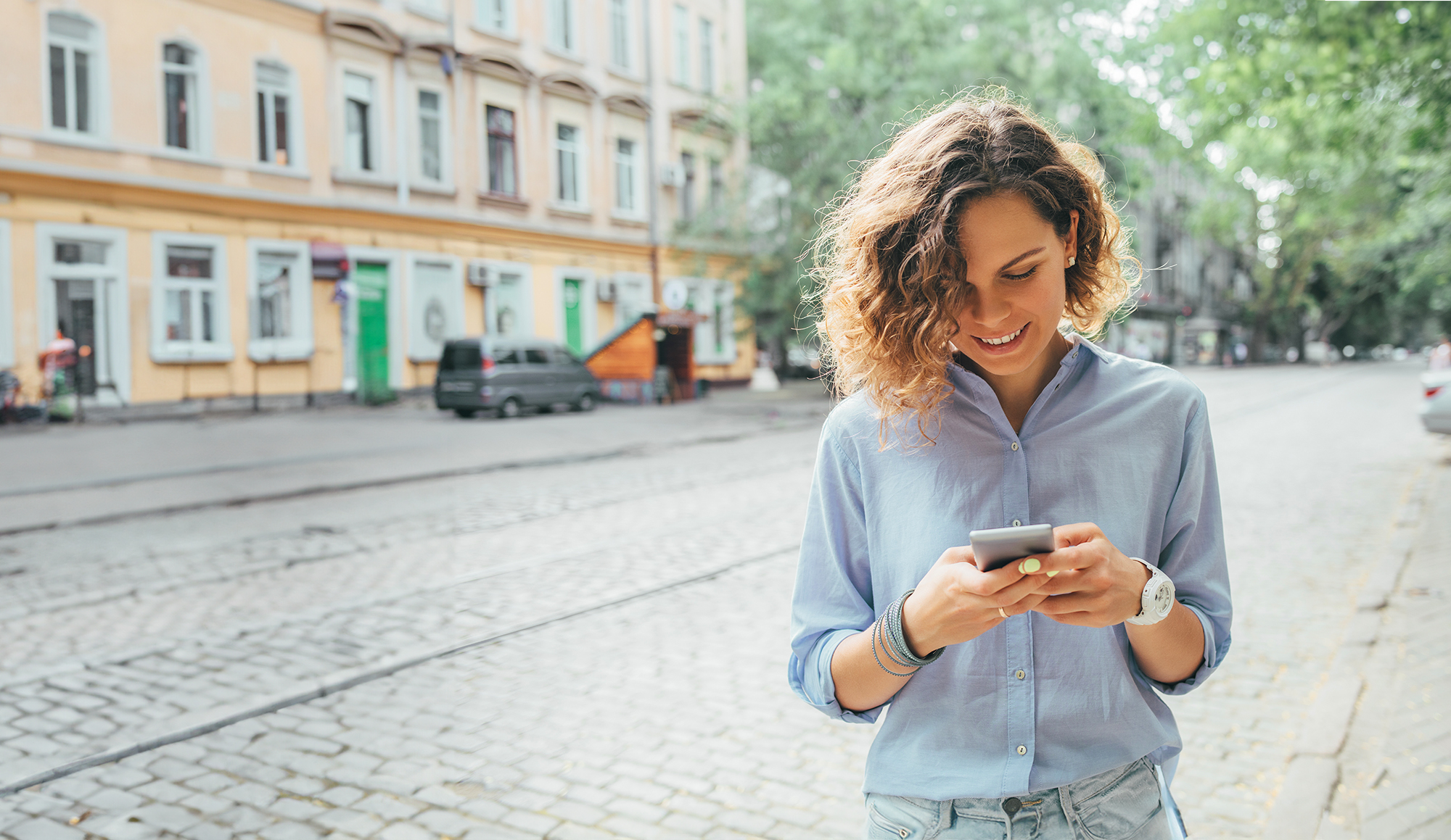woman outdoors using mobile phone