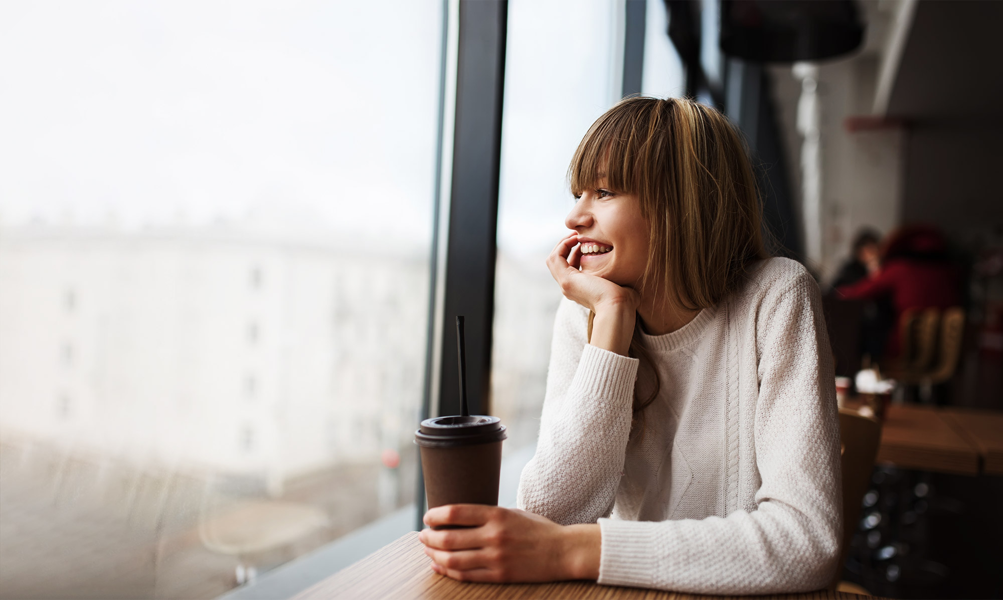 woman looking out window