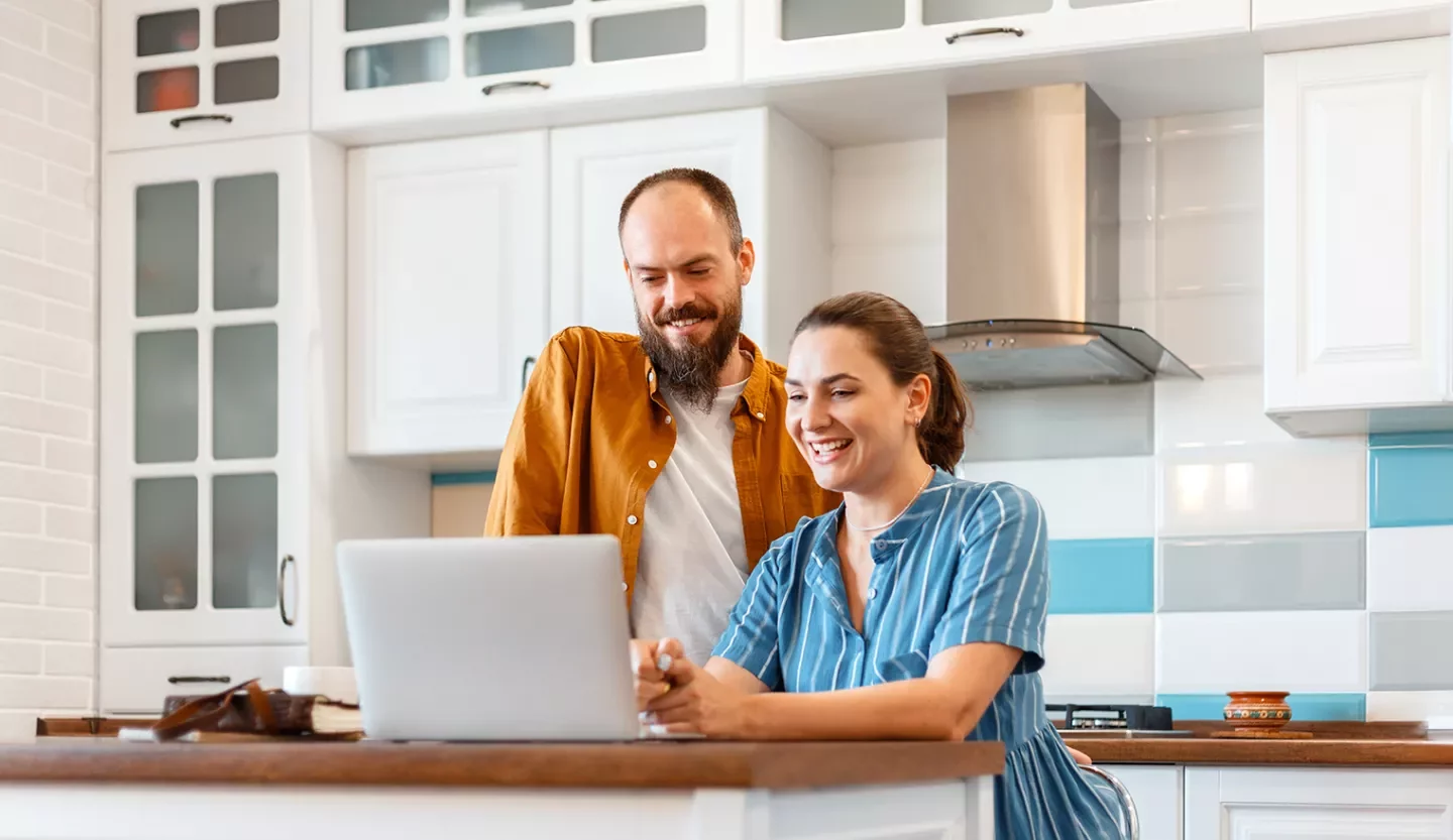 two people on laptops