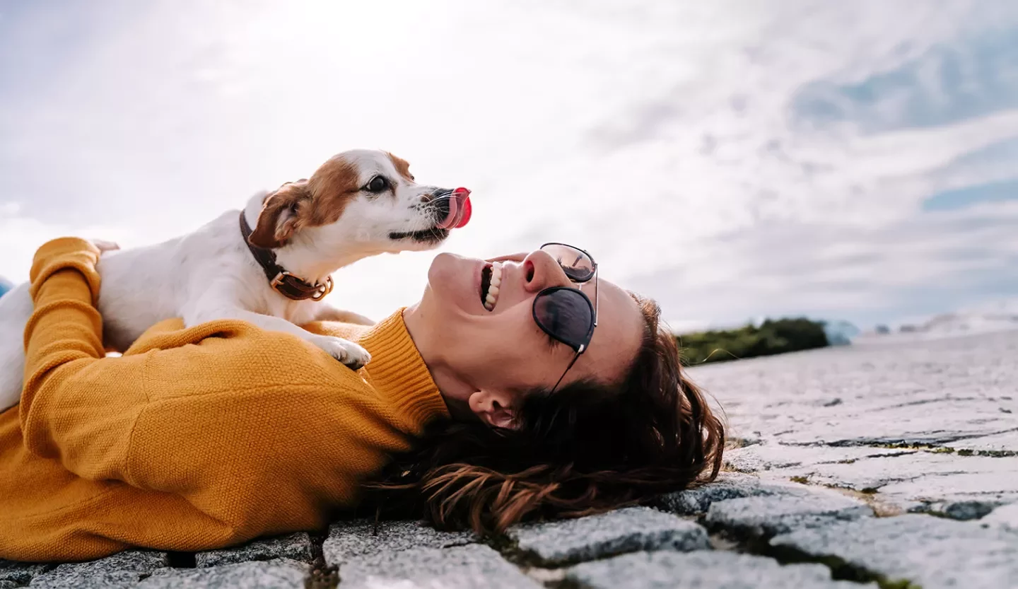 woman and dog at beach