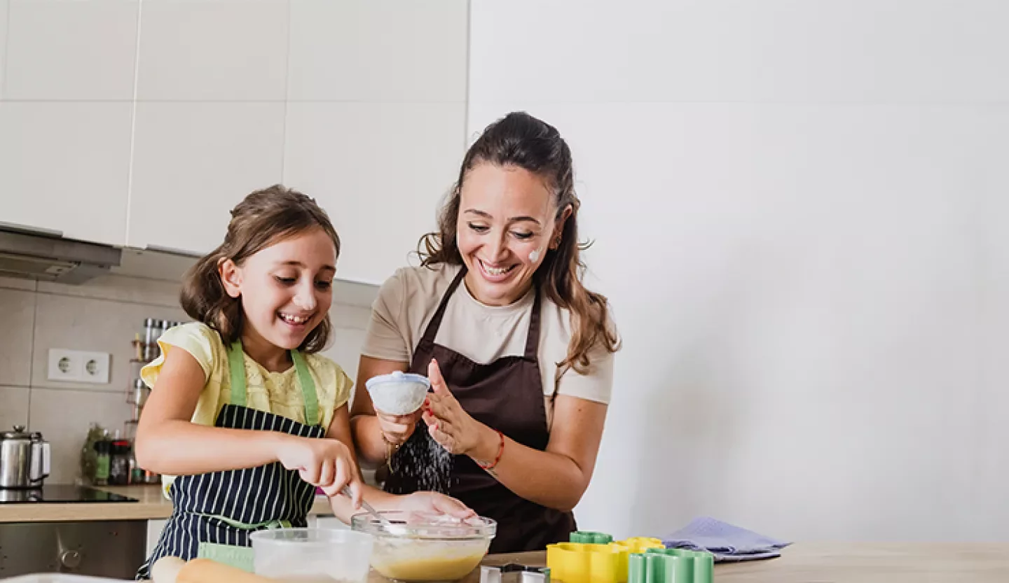 person cooking with child