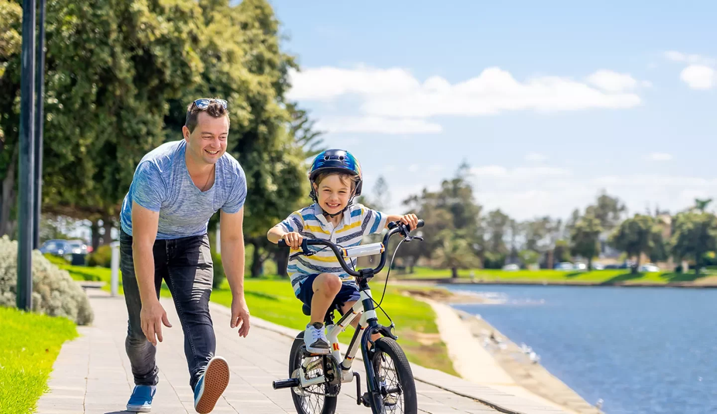 person with kid on bike