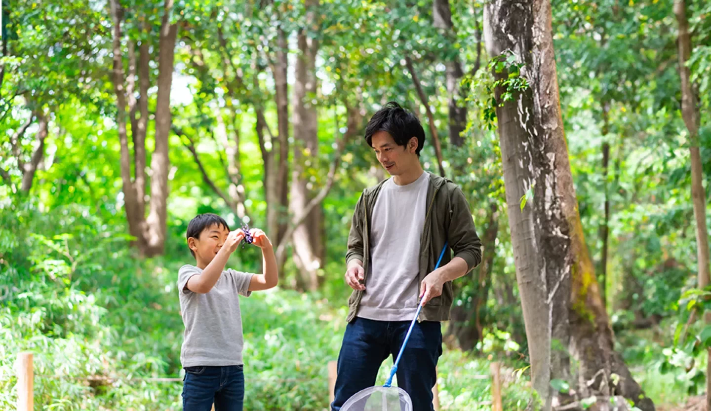 person with child in the woods