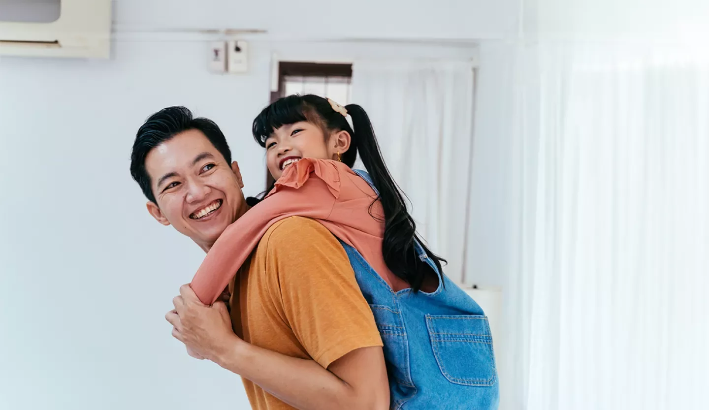 person with child on back